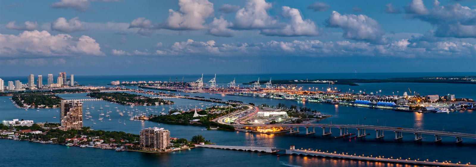 Panorama of a Florida cruise port and city skyline at dusk