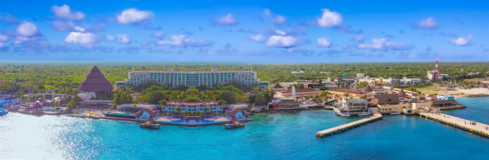 Panorama of the Cozumel waterfront and cruise piers on a sunny day